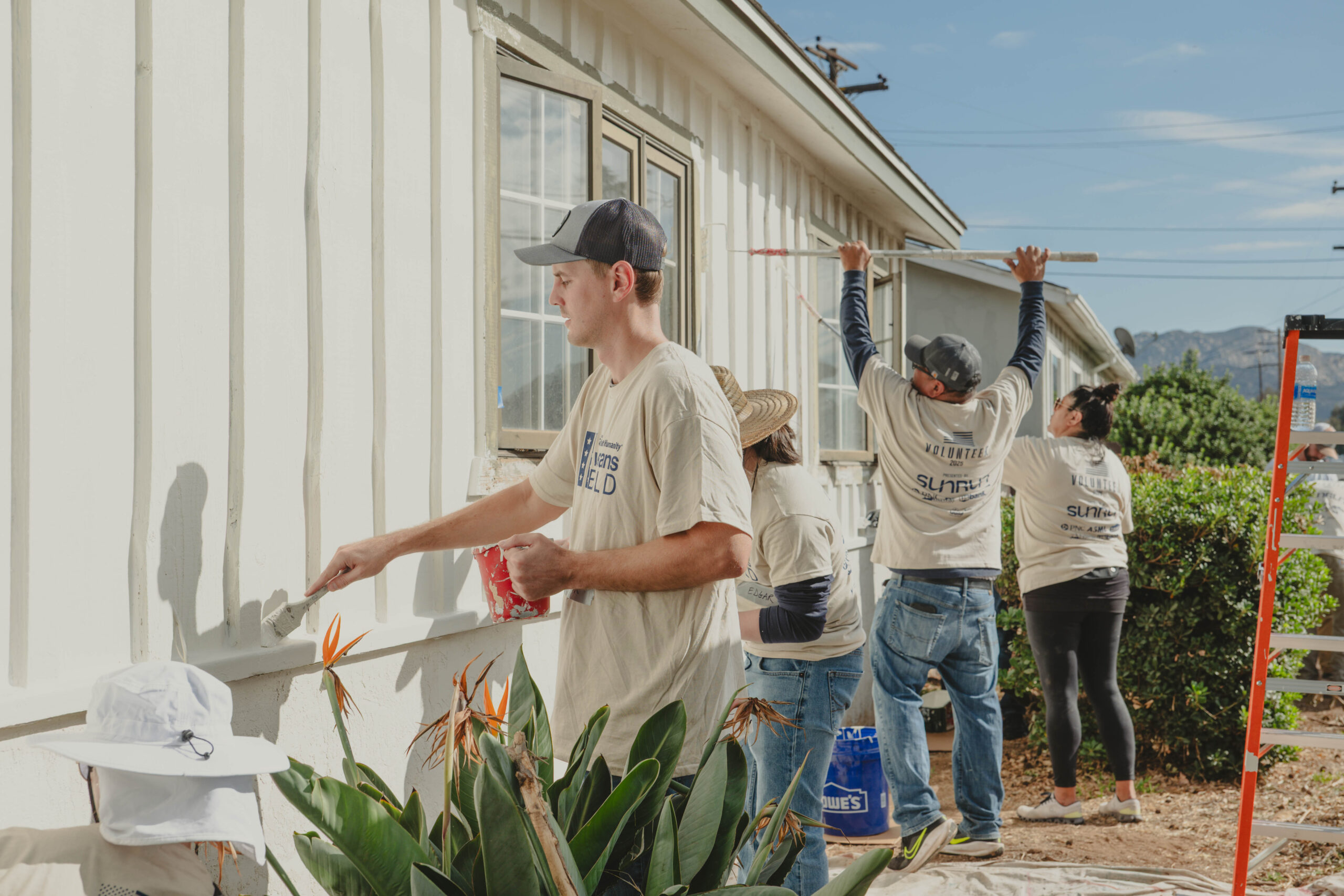 P3194450 Veterans Build - group painting a home