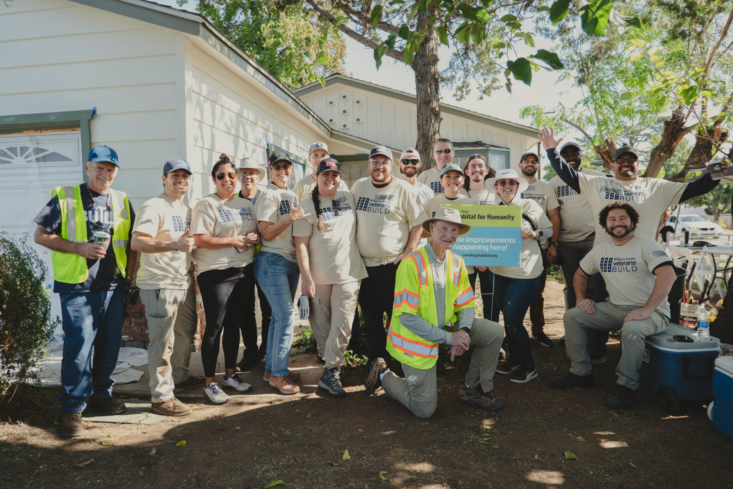 P3194560 Veterans Build 2025 group photo in front of completed home.